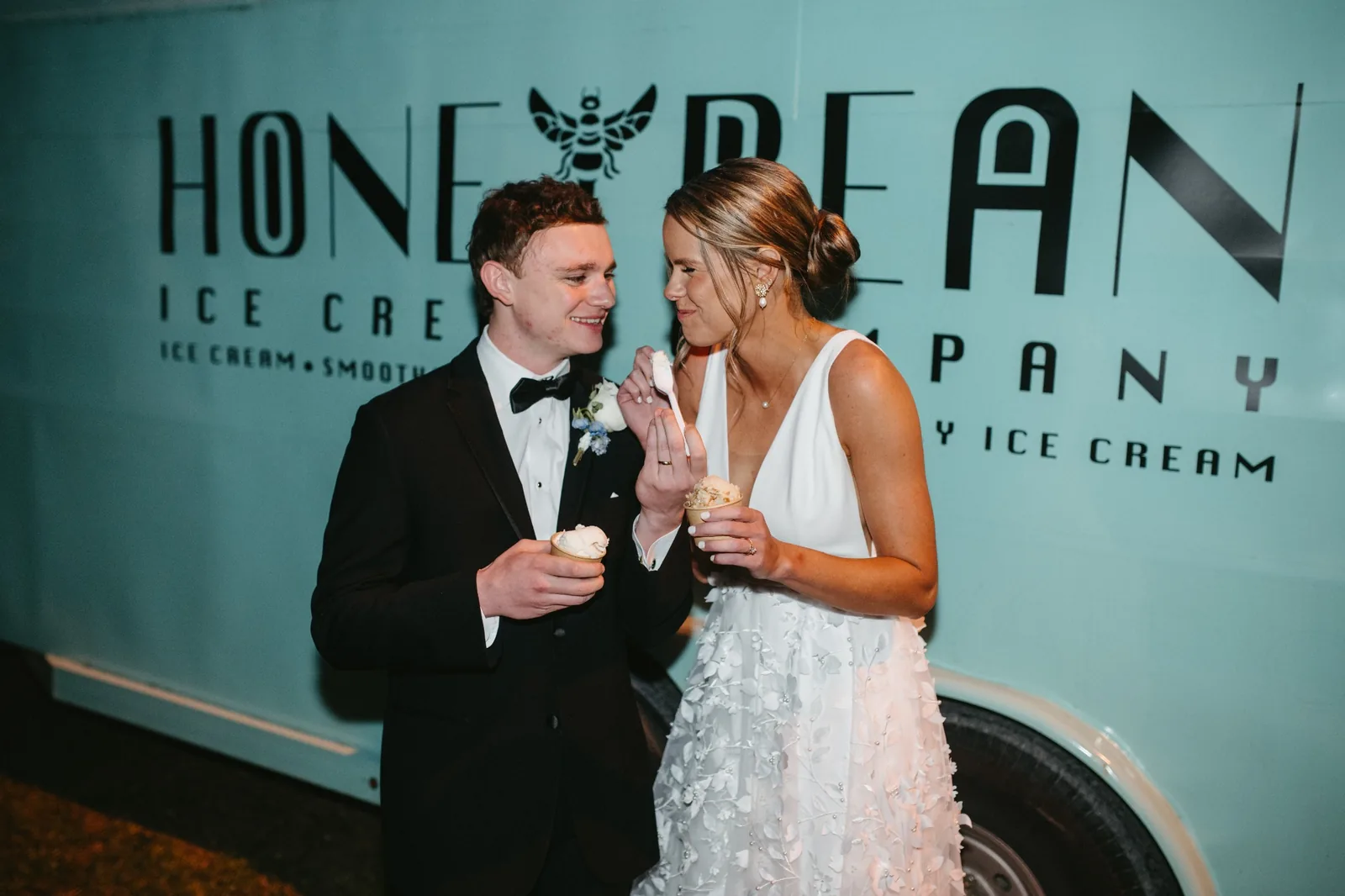 Bride and groom enjoying Honeybean ice cream at their wedding